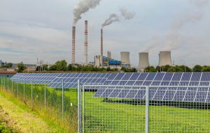 coal plant near solar panels