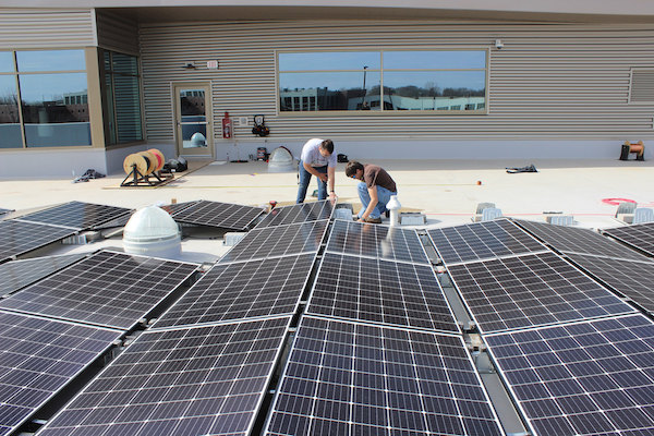 Students at Northeast Wisconsin Tech College install solar panels
