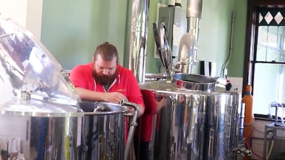 ryan cleaning equipment at the brewery