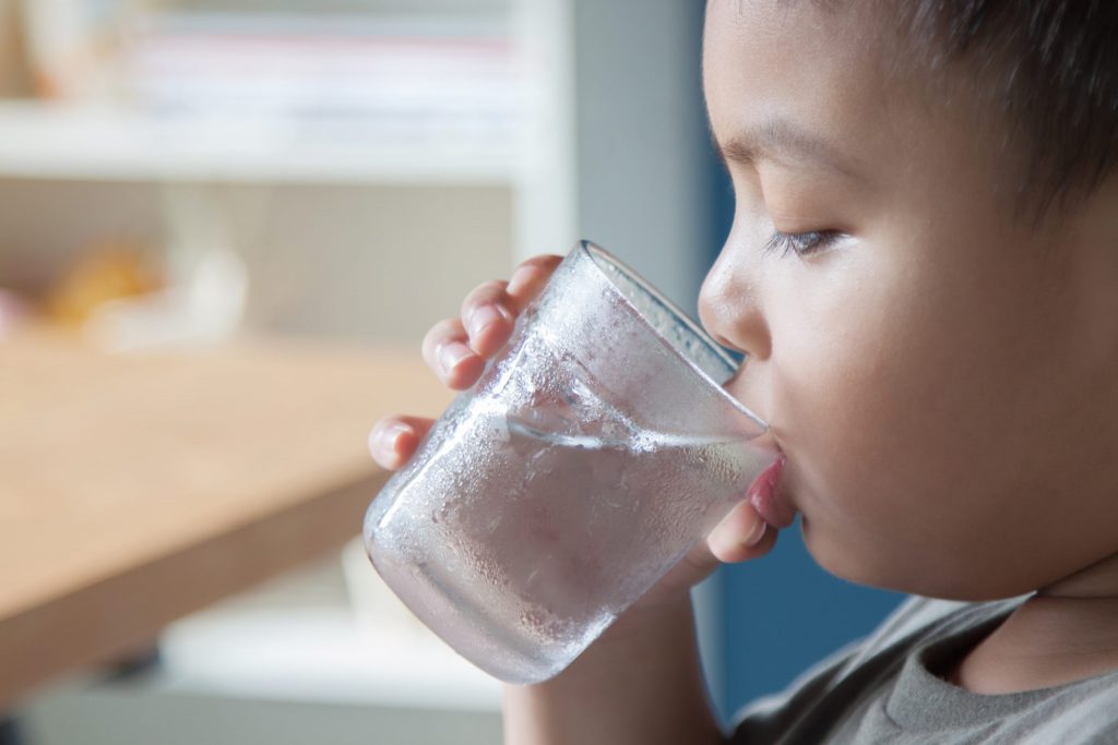 Child drinking water.