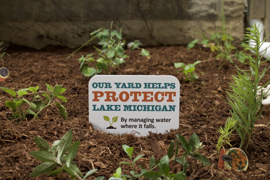 Sign in a yard that says, "Our yard helps protect Lake Michigan"