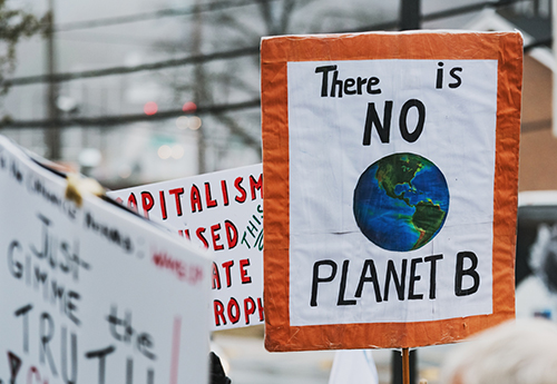 Climate change protestors hold their placards high
