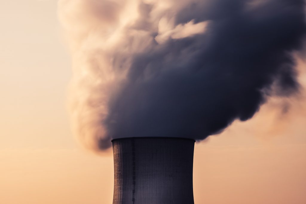 Large smoke stack emitting billows of smoke