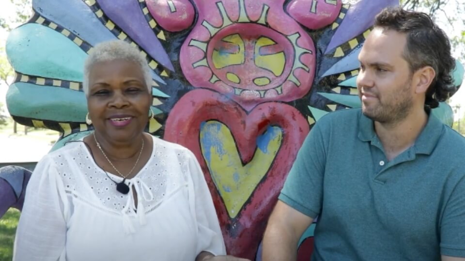 Yvonne & Ethan discussing rain barrels
