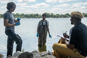 Staff scientist Paul Mathewson works with summer science interns