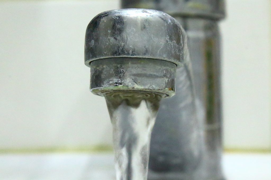 Water flowing from older faucet