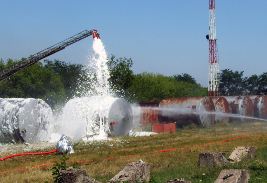 Firefighting foam washing over tank