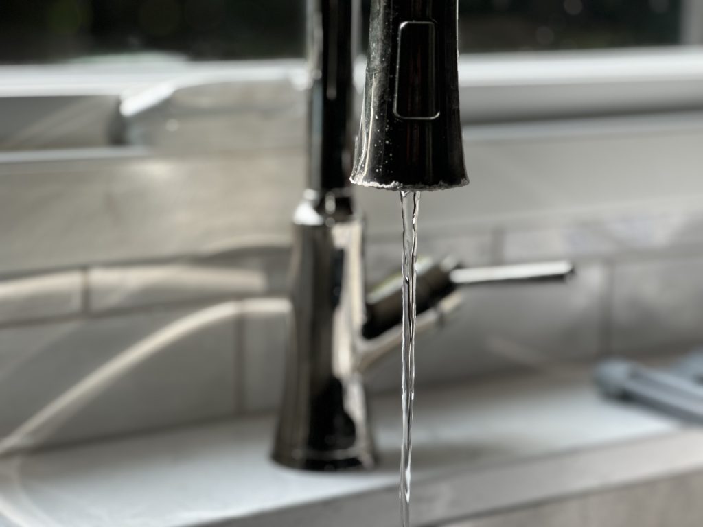 kitchen faucet with water running; Photo: Clean Wisconsin