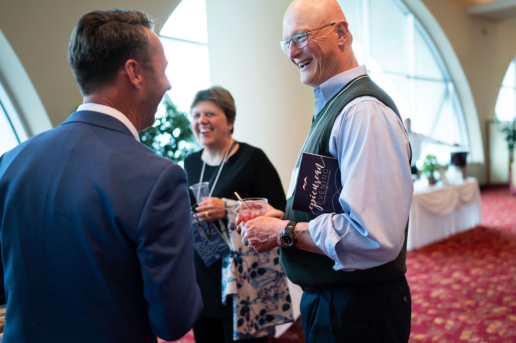 Attendees of the 10th annual Epicurean Evening talk during cocktail hour.