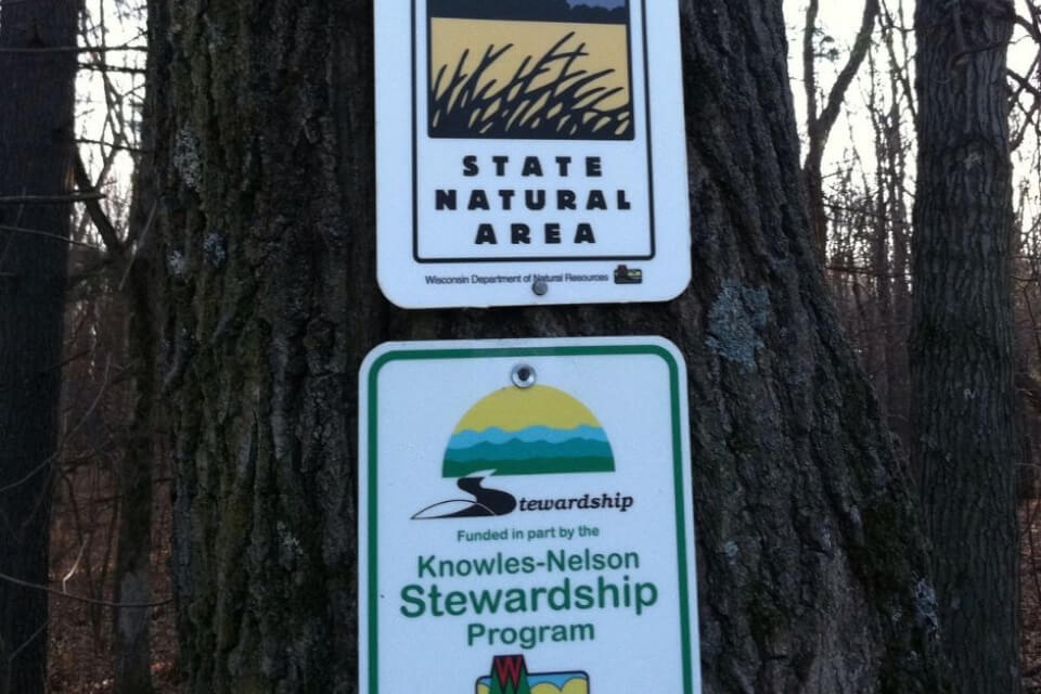Park sign showing a sign that says "funded by Knowles-Nelson stewardship program"
