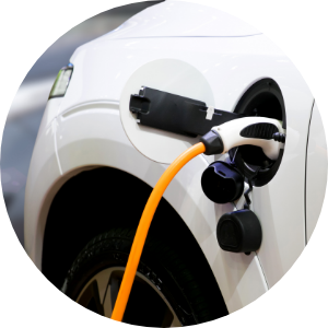 An electric car plugged in at a charging station 