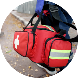 A person carrying an emergency services bag