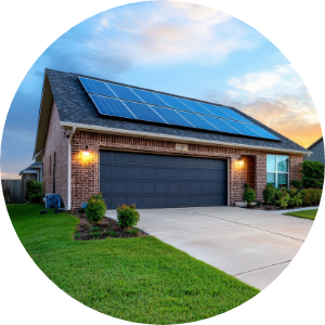 A brick home with solar panels on the garage roof